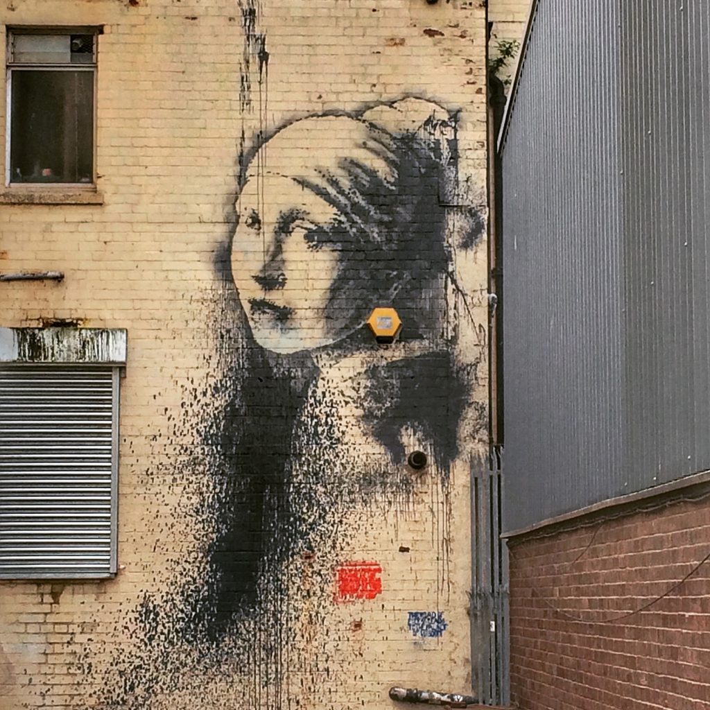 Bristol- Banksy artwork. Read this insider's guide to learn the top attractions in Bristol, England, food in Bristol, and accommodation in Bristol. #bristol #england #uk #bristoltraveling #travelbuide #bristolguide