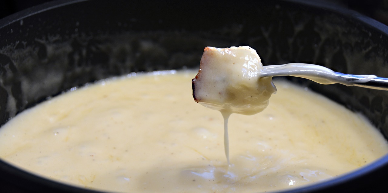 Fondue cheese - one of the cool experiences in Zurich, Swtizerland