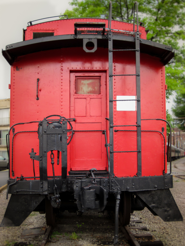 Bright red caboose at the rear of a train on display in Chattanooga, Tennessee