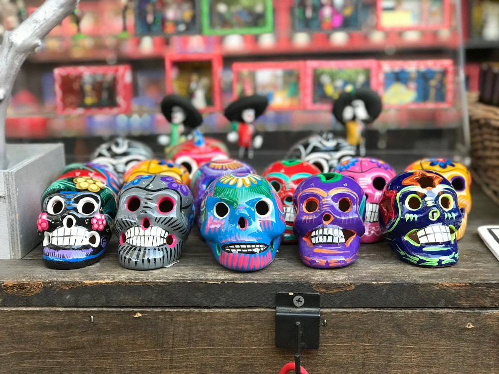 A picture of painted skulls celebrating the Day of the Dead with Royal Holiday Vacation Club