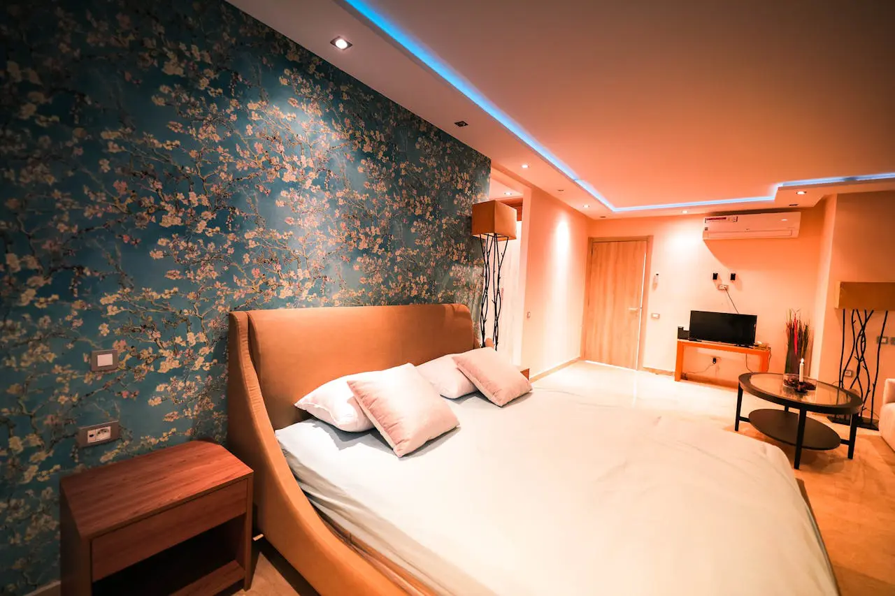 Modern bedroom with warm lighting that supports healthy sleep routines and better longevity