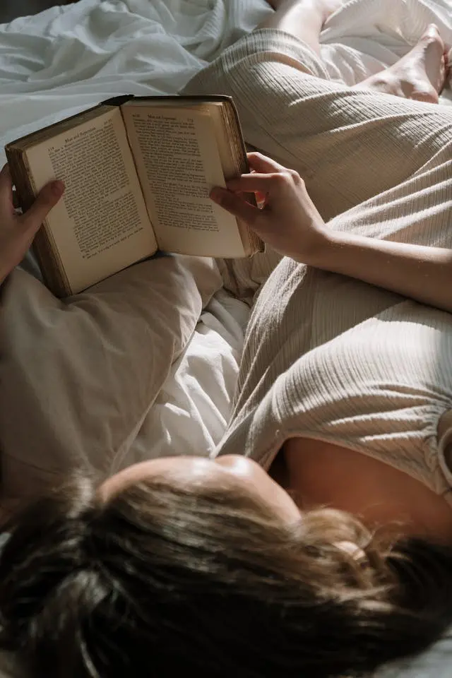 woman reading - Create a Soft Landing for Sleep - Simple Evening Habits Make You Sharper and More Focused Tomorrow