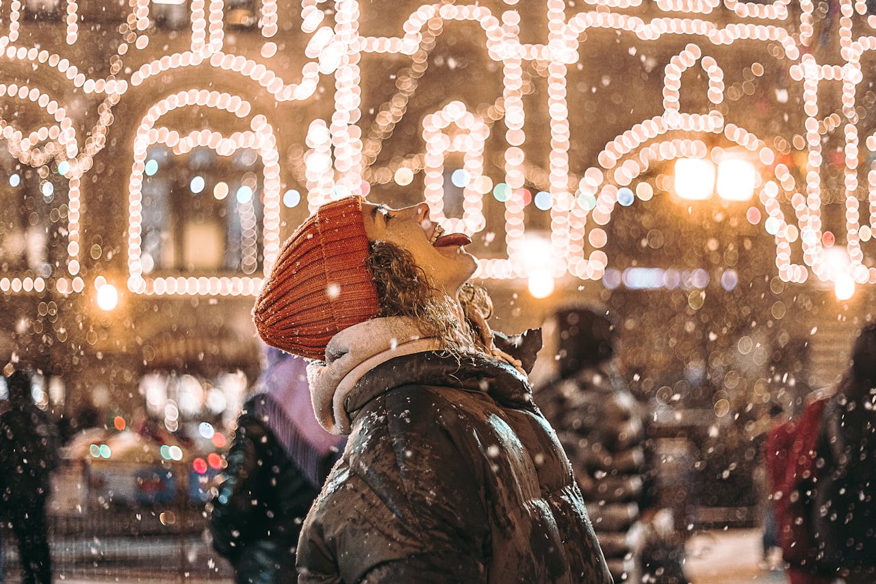 how can I stay healthy during winter trips - woman wanting to eat a snowflake