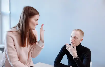 woman signaling a boundary during conversation showing conversational red flags