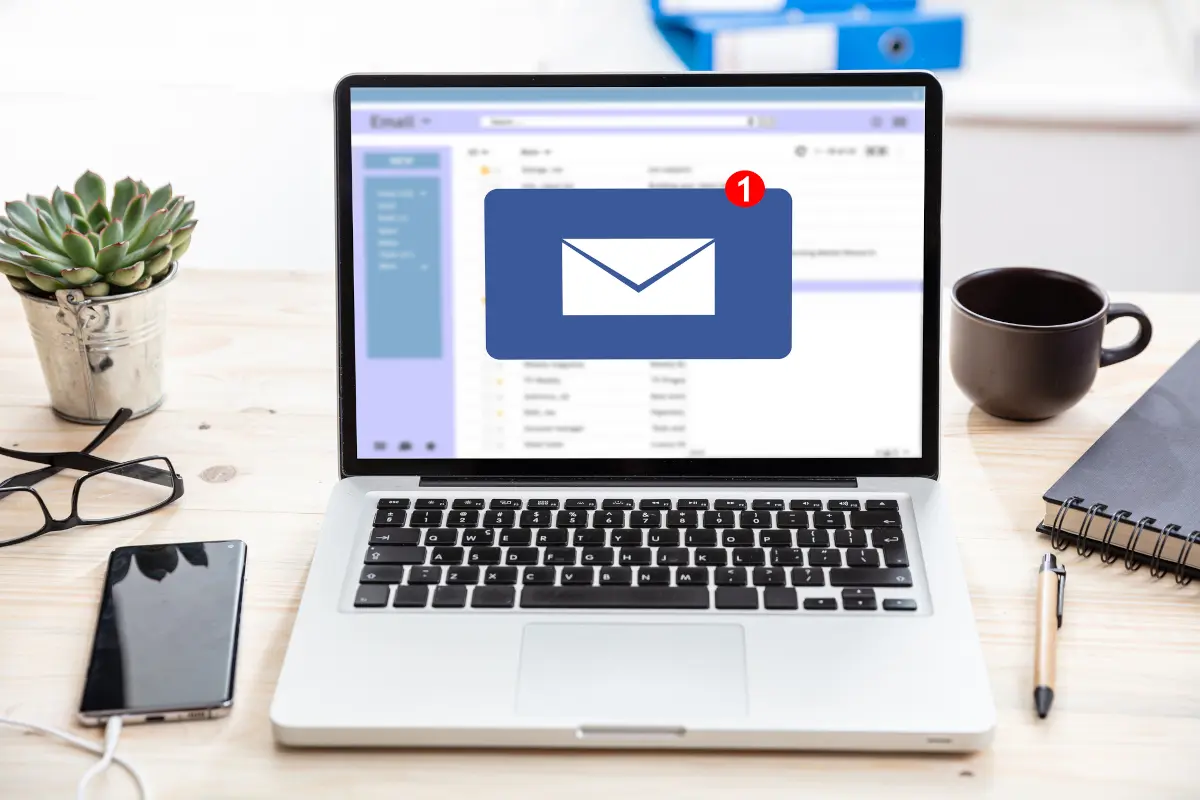 Laptop screen showing a new email notification, representing inbox messages and follow-up emails