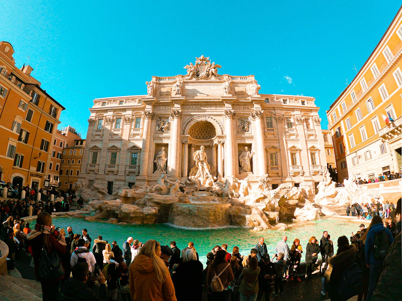 The beatiful Trevi Fountain in Rome and the tourists seeing it