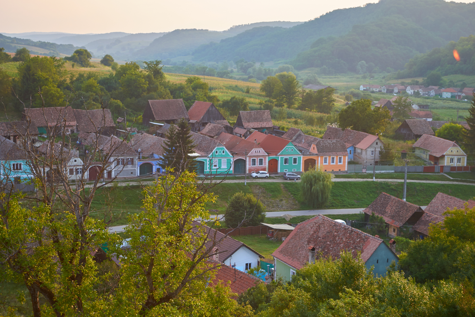 Alma Vii village in Transylvania, Romania, at sunset, with colorful houses showing the rural culture behind many Romanian proverbs and sayings