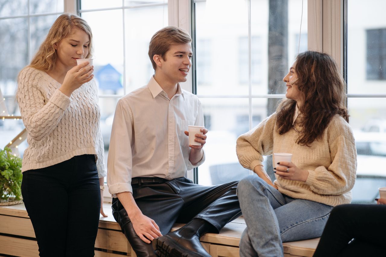 Friends talking over coffee during a casual conversation