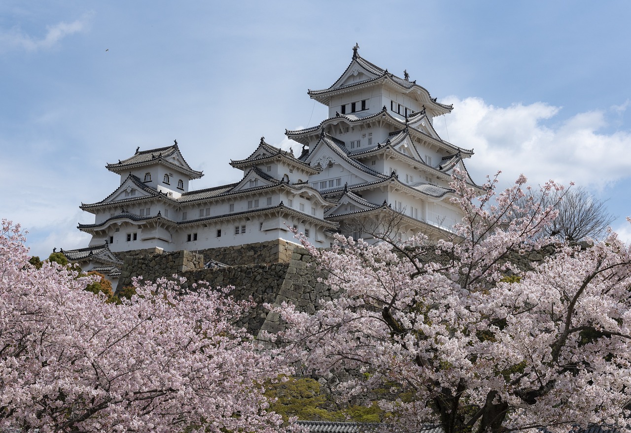 Himeji Castle in Japan with cherry blossoms for a famous landmark country quiz