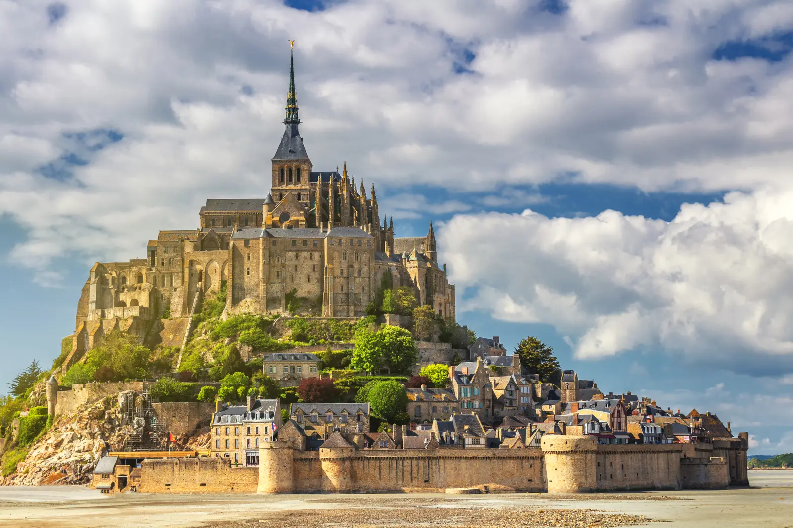 Mont Saint Michel abbey and medieval village in Normandy France for an article with 50 Interesting Facts About France That Go Beyond Paris