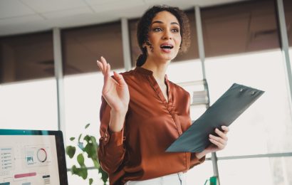 Businesswoman speaking confidently during a professional office meeting. what to say instead of sorry