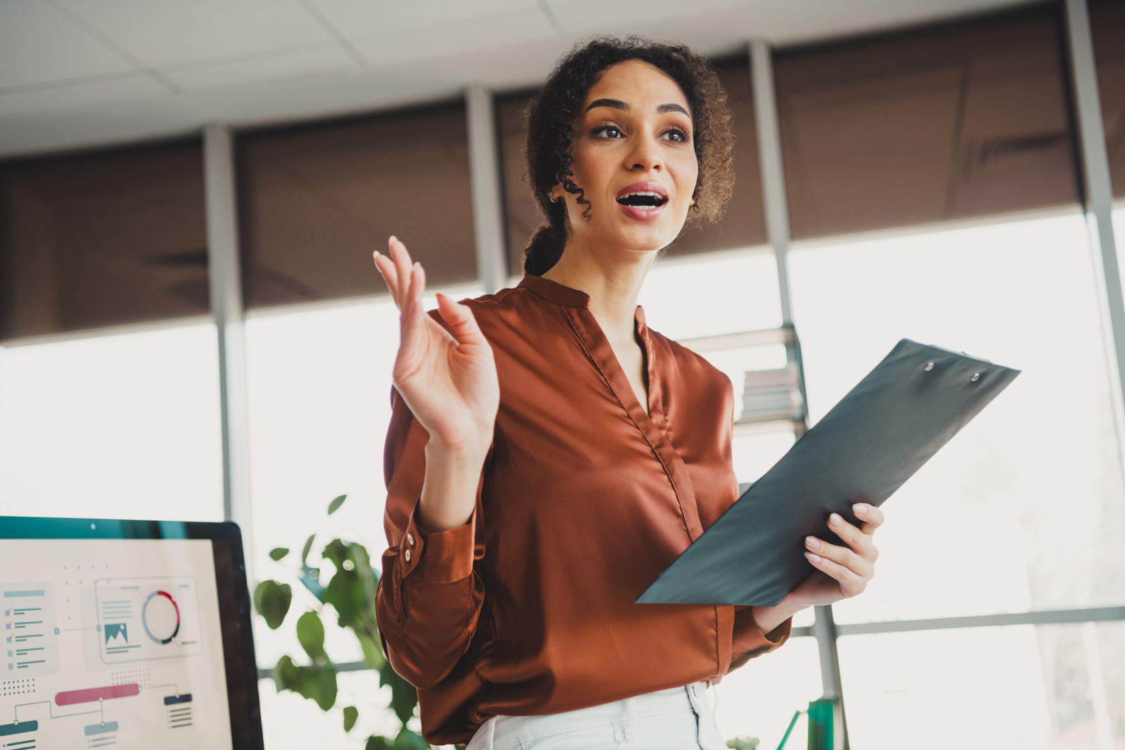 Businesswoman speaking confidently during a professional office meeting. what to say instead of sorry