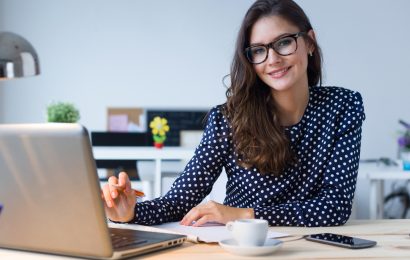Woman working on a low-cost online business from her laptop
