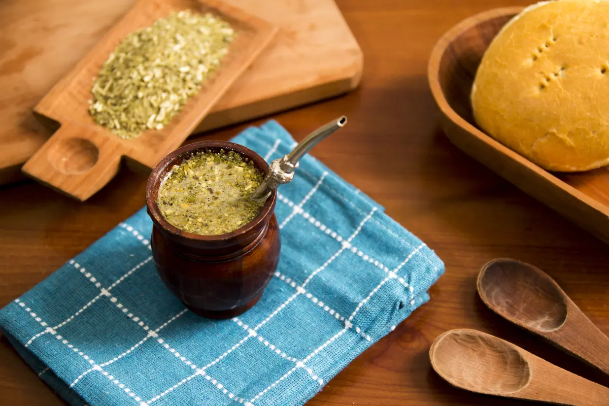 Traditional Argentine yerba mate in a wooden gourd with a metal bombilla