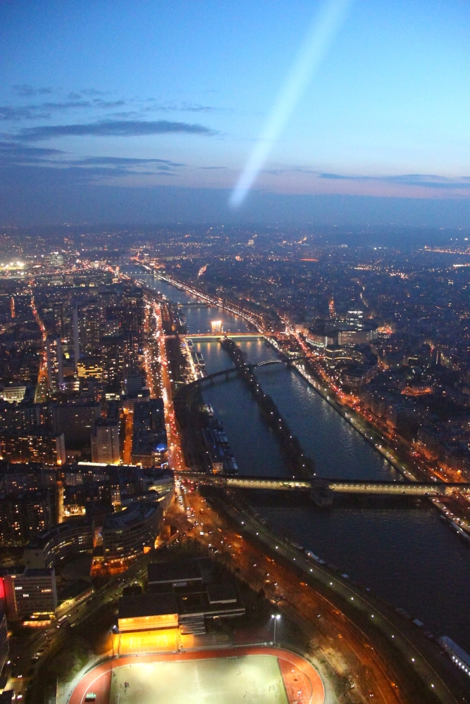 The Seine and illuminated Paris viewed from the Eiffel Tower summit