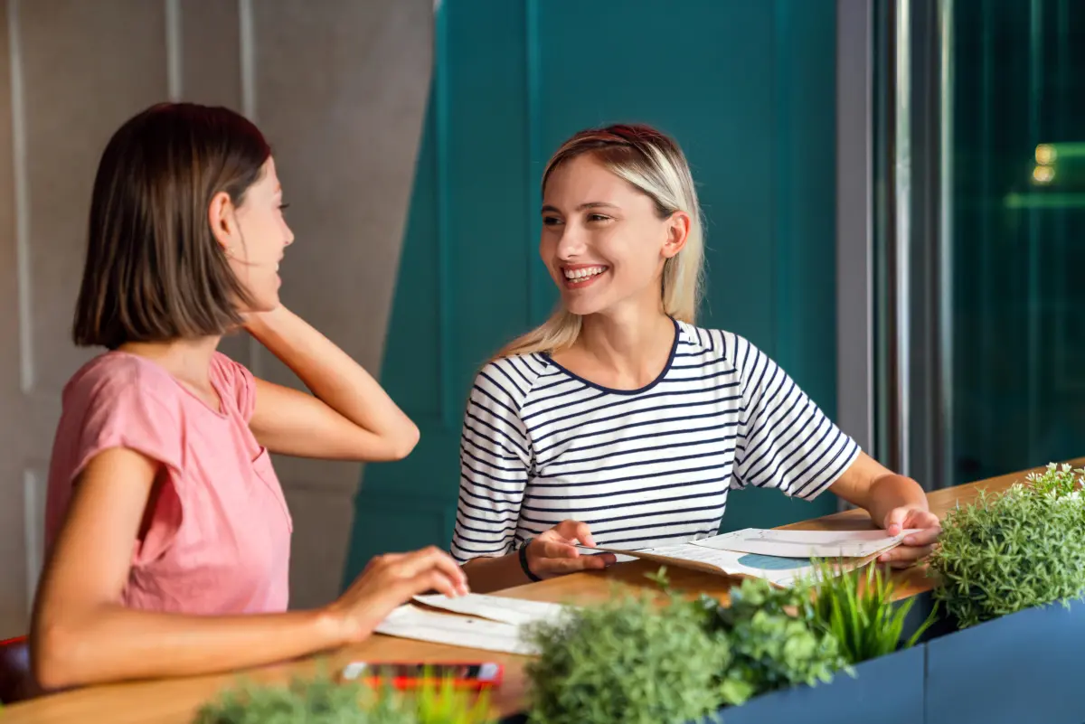Two women talking over tea during a casual conversation