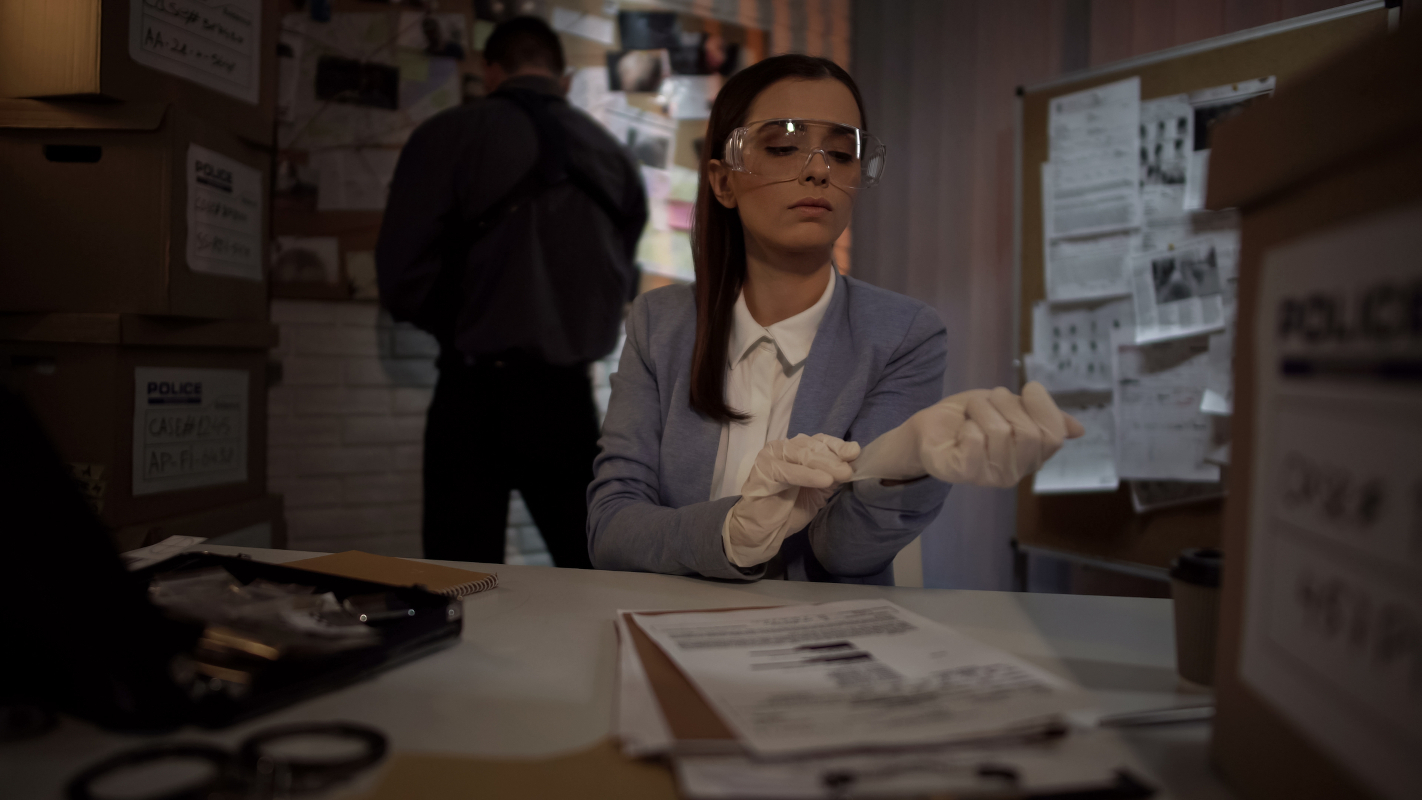 Forensic investigator preparing to examine evidence