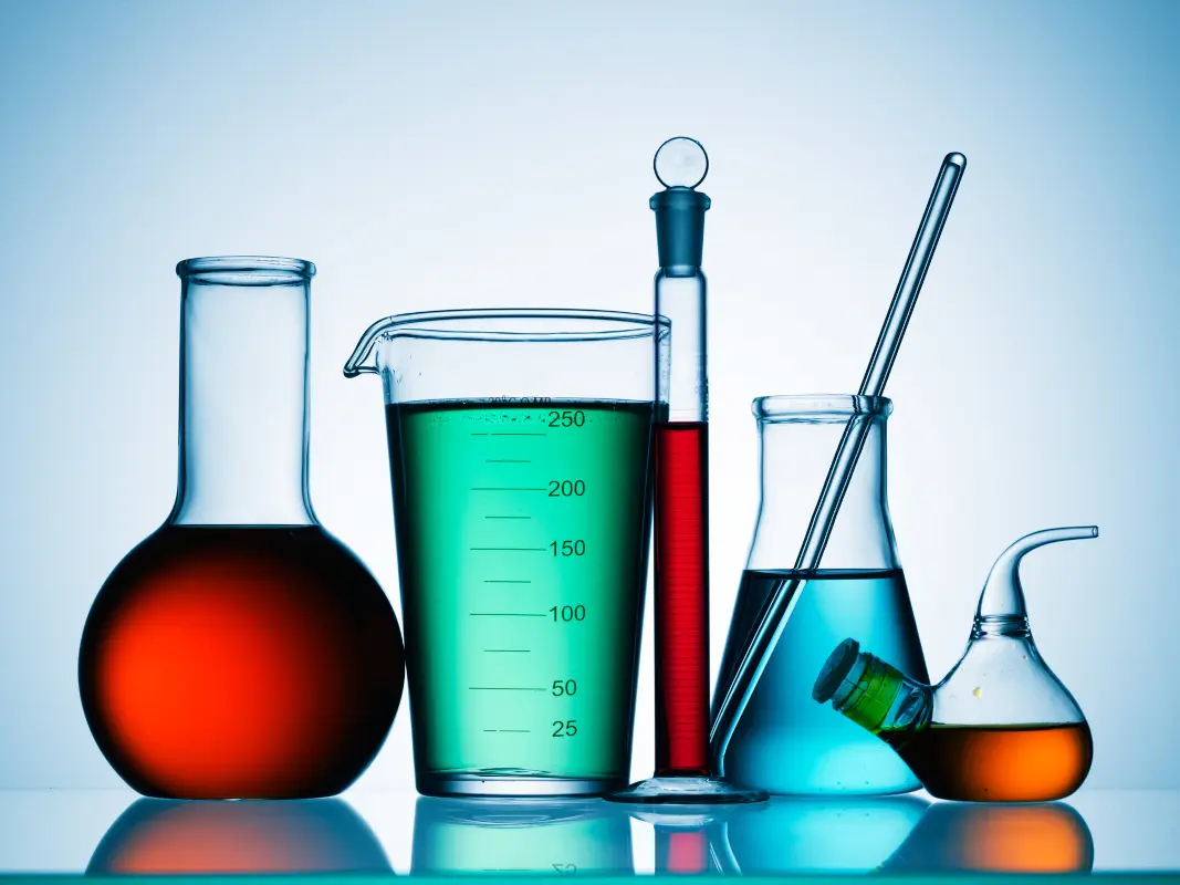 colorful chemicals and glassware in a science laboratory for a science quiz