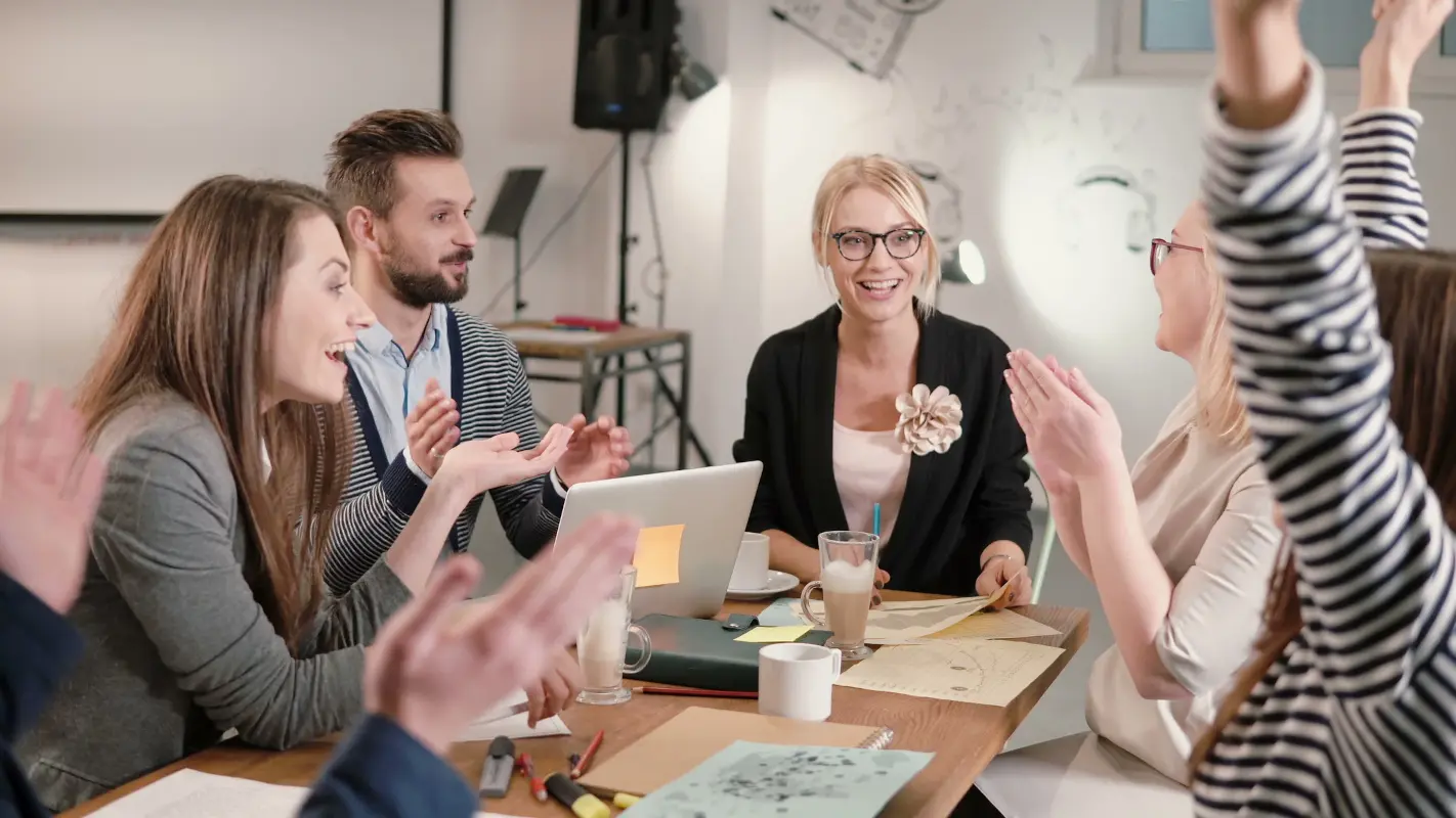 Business team celebrating good news together in the office
