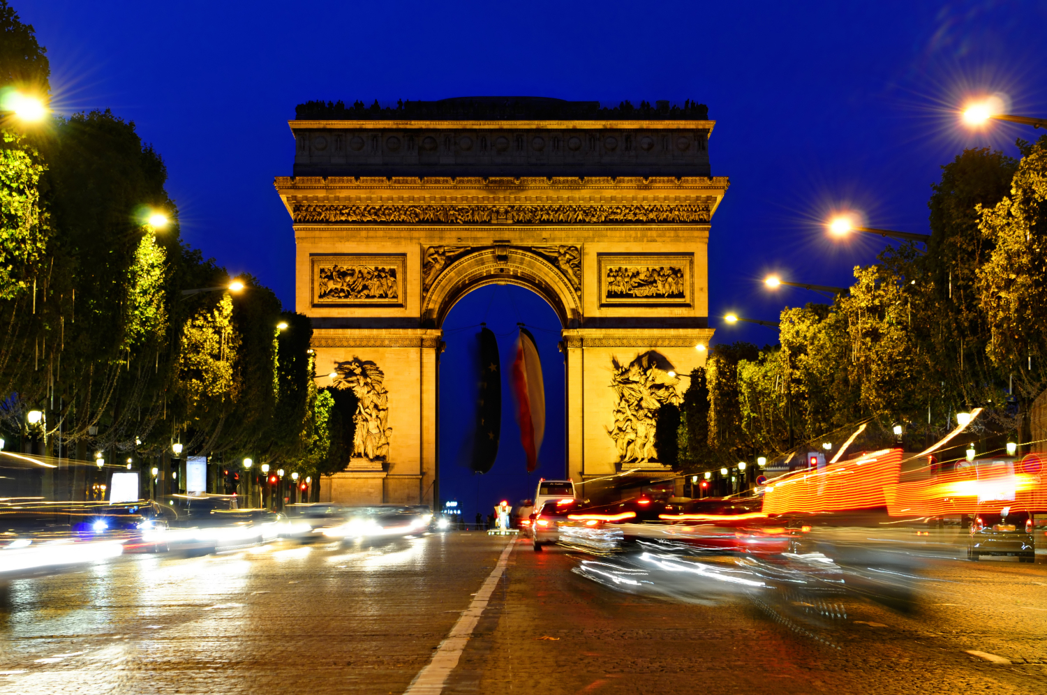 Arc de Triomphe at night in Paris France