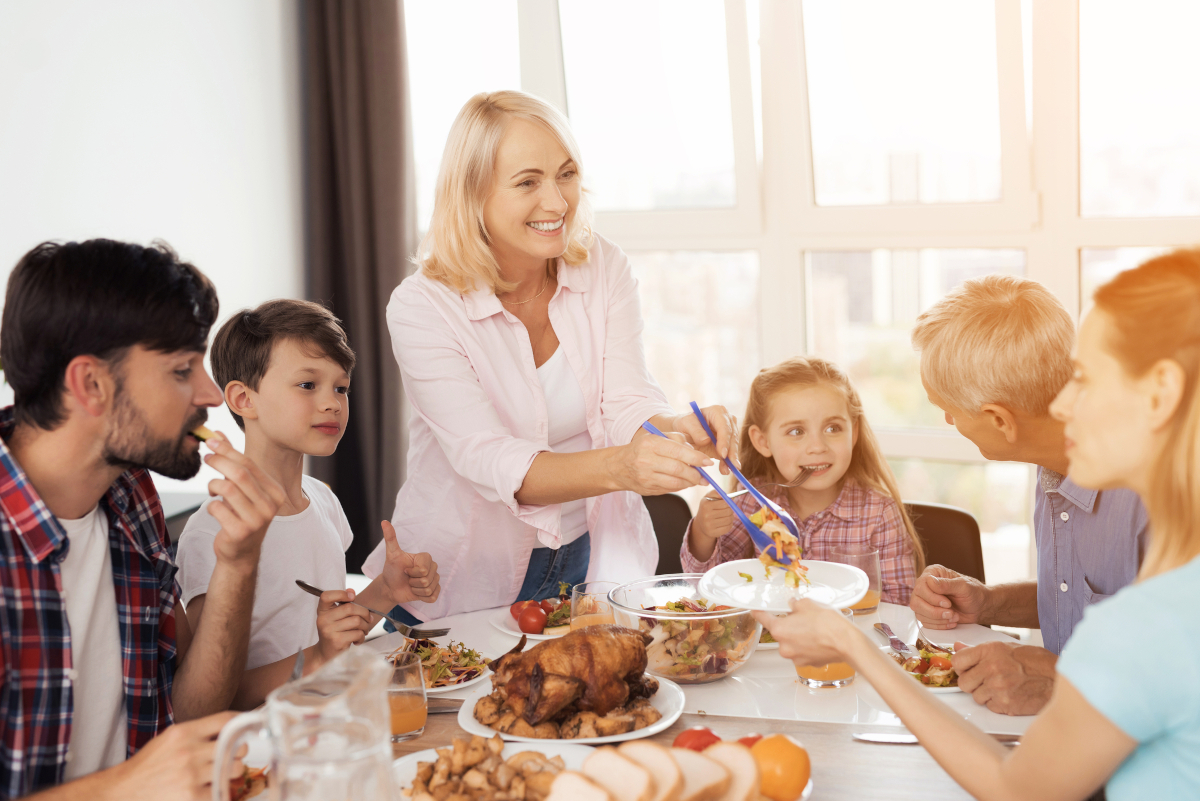 Thankgiving dinner conversation starters for grandparents and family members - a grandmother serving dinner