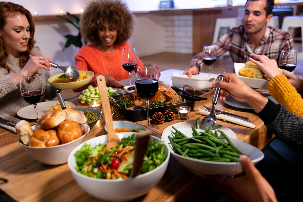 Friends having Thanksgiving dinner
