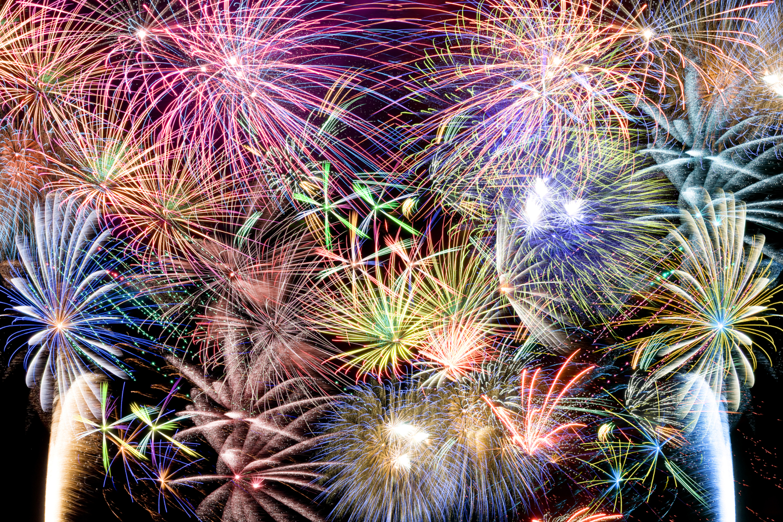 Colorful fireworks lighting up the night sky during a New Year celebration