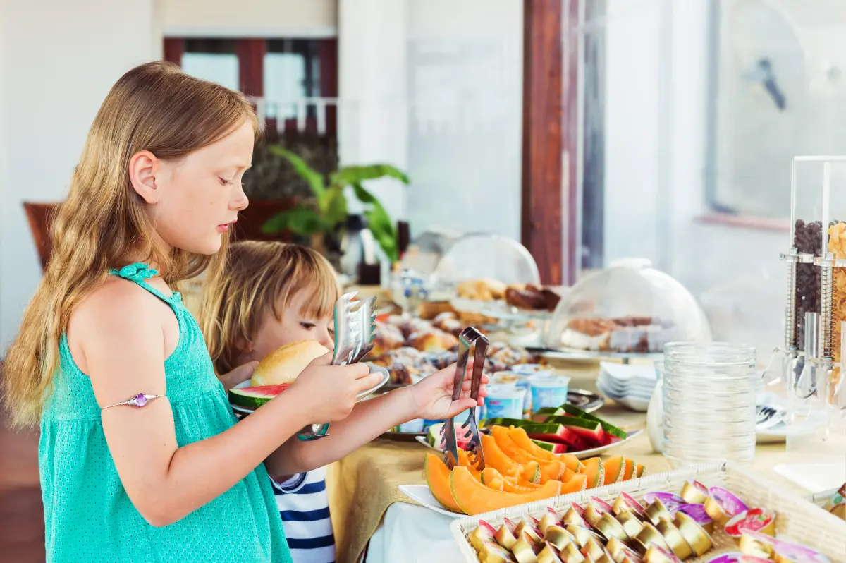 Kids choosing breakfast in a hotel restaurant - should I buy hotel breakfast?
