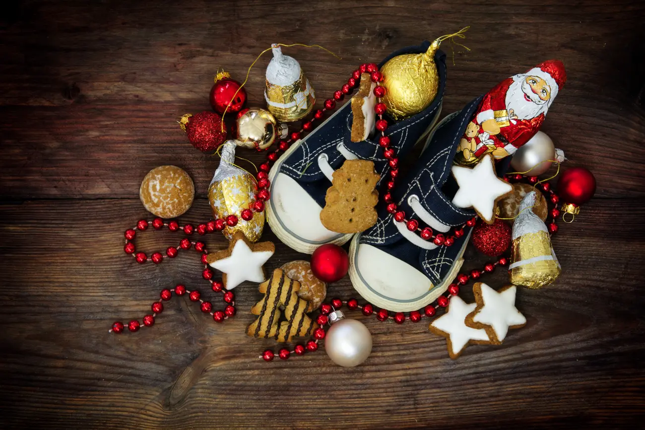 Children's shoes filled with sweets and Christmas treats for Saint Nicholas Day on December 6