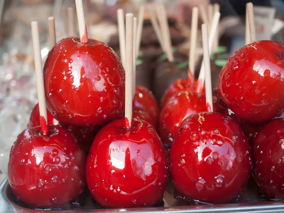 Red candied apples displayed for sale at the Rathaus Christmas market in Vienna