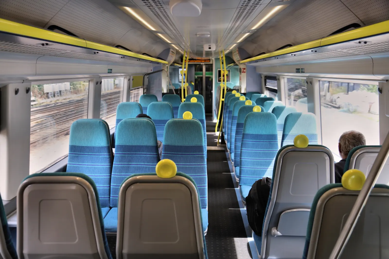 Interior of a passenger train in the UK with rows of seats, illustrating a dispute over a reserved train seat.
