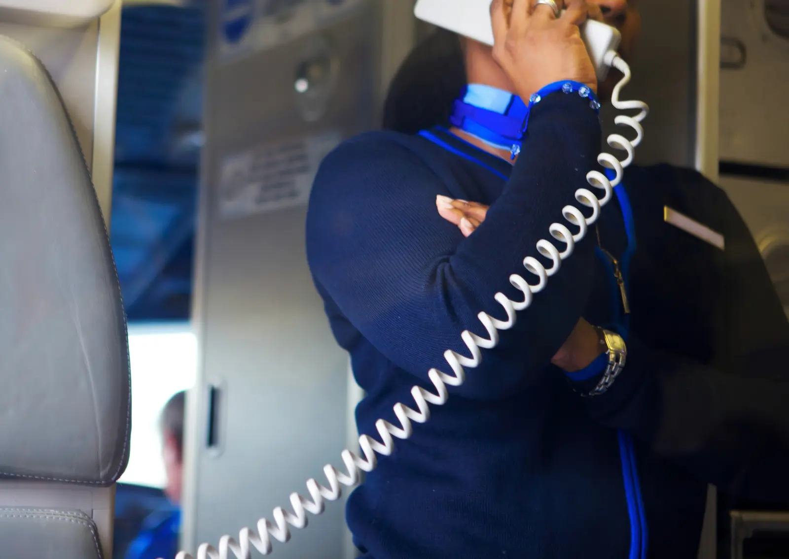 Flight Attendant making an Announcement on airplane
